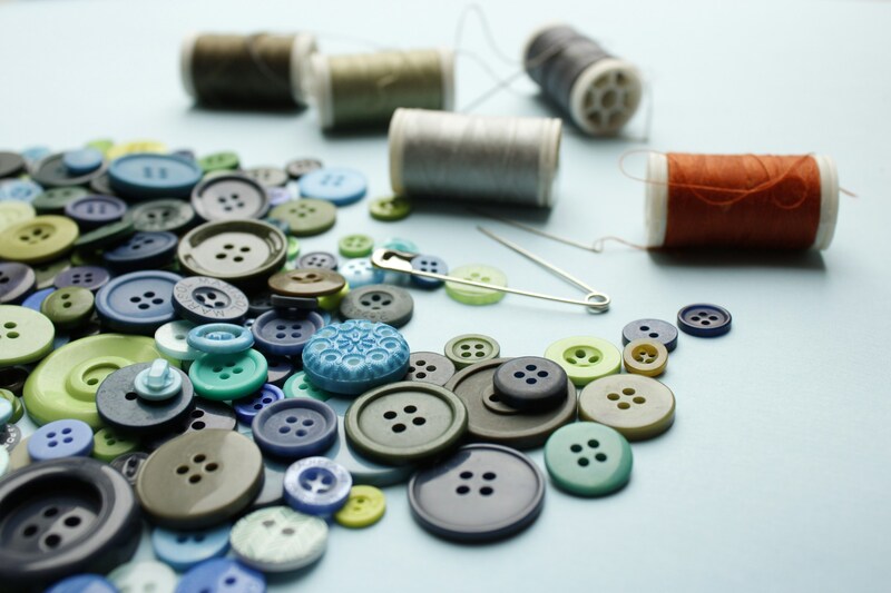 How to sew on a button correctly?