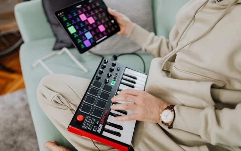 What is a MIDI keyboard used for in music production, from playing instruments to recording notes